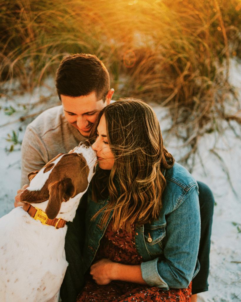 Happy childfree couple with dog outdoors - DINKWAD lifestyle representing dual income no kids with a dog
